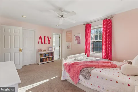 a bathroom with a toilet a sink and a mirror