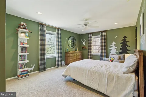 a view of a room with projector and furniture