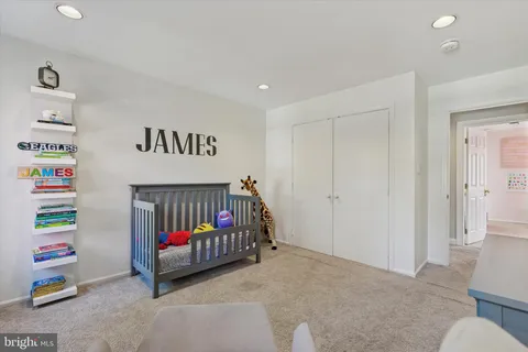 an aerial view of a house with swimming pool garden and patio