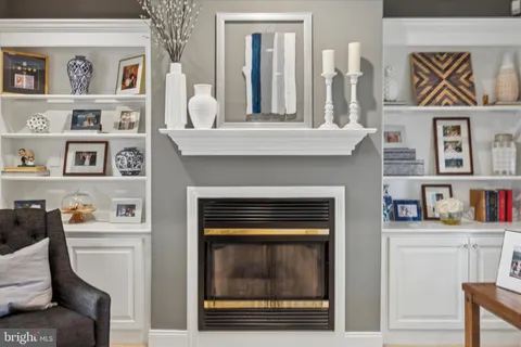 a view of a dining room with furniture wooden floor and a chandelier