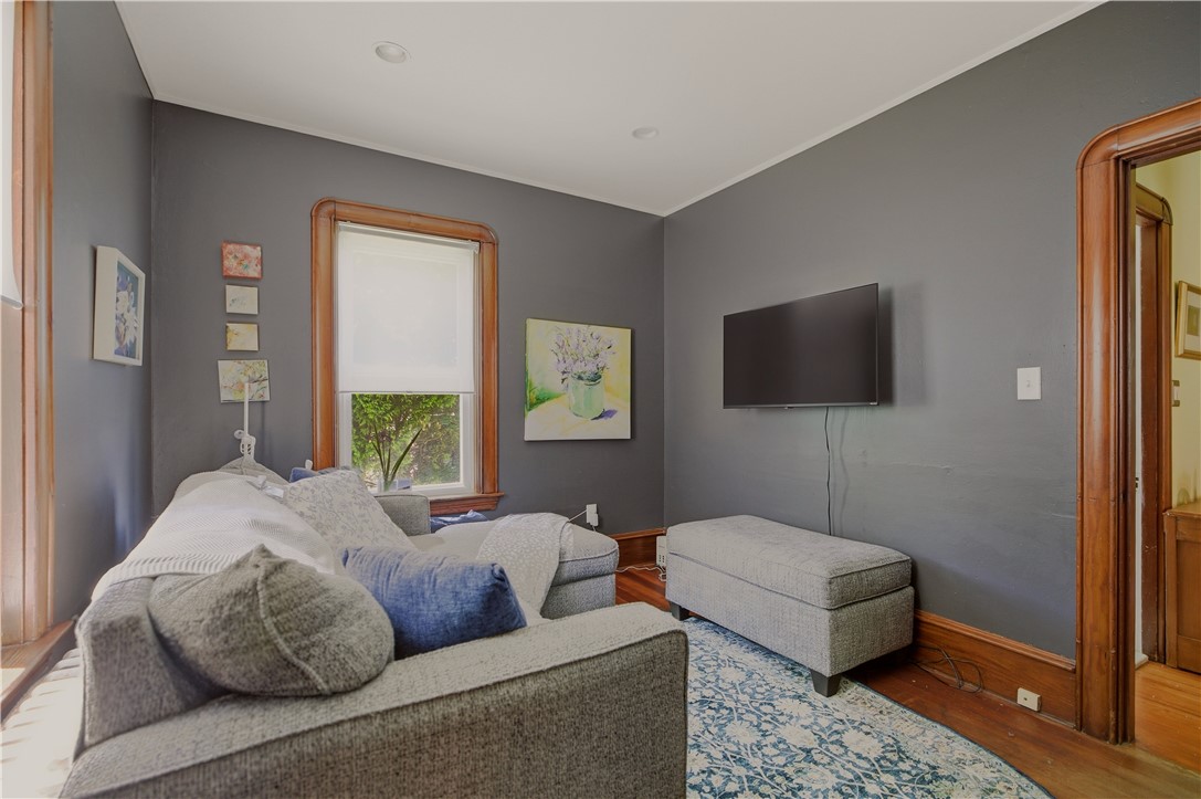 1536 Main Road Tiverton, RI 02878 - Photo 20 of 34 Cozy den with windows to gardens and stonewalls