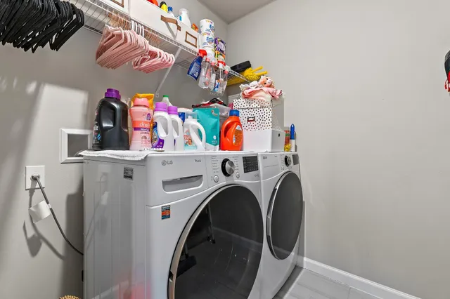 a bedroom with a bed and a flat tv screen