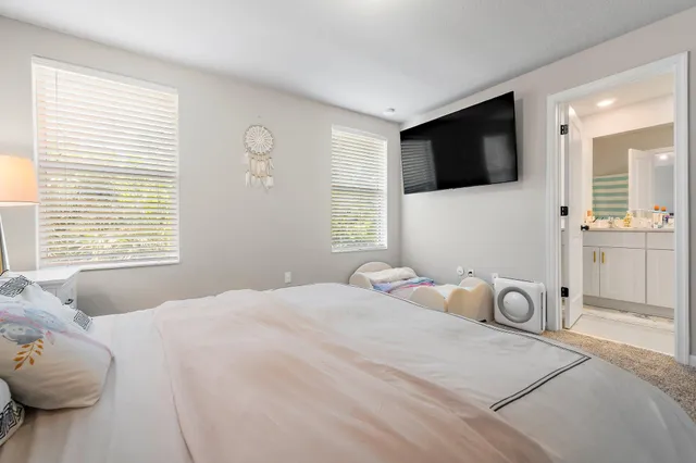 a view of walk in closet with clothes