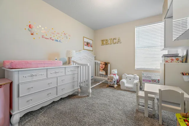 an aerial view of house with yard swimming pool and outdoor seating