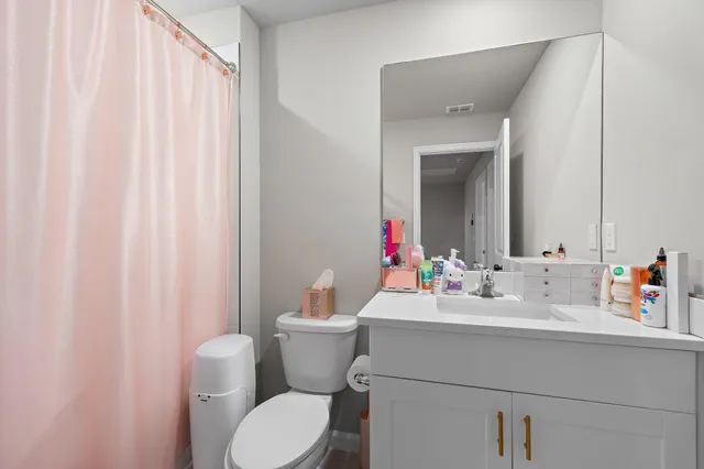 an aerial view of houses with outdoor space and swimming pool