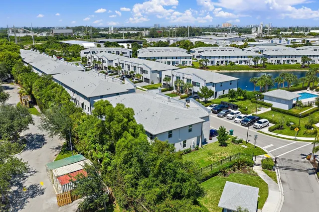 an aerial view of a house with swimming pool patio and outdoor seating
