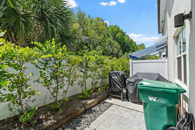a view of a city with lots of residential buildings ocean and mountain view in back