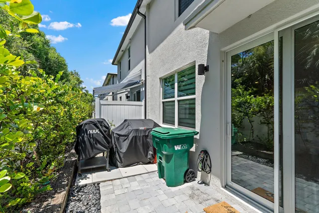 an aerial view of a house with a swimming pool outdoor seating and yard