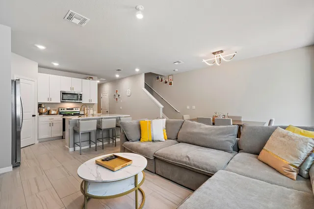 a living room with furniture and a large window
