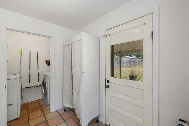 a bathroom with a shower and a sink