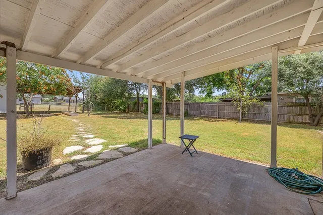 a view of a swimming pool with an outdoor space and seating area