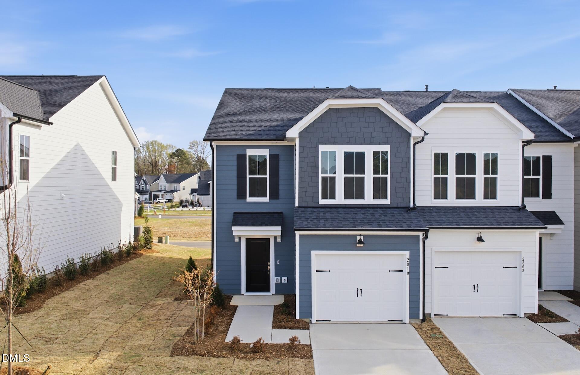 a front view of a house with a garage