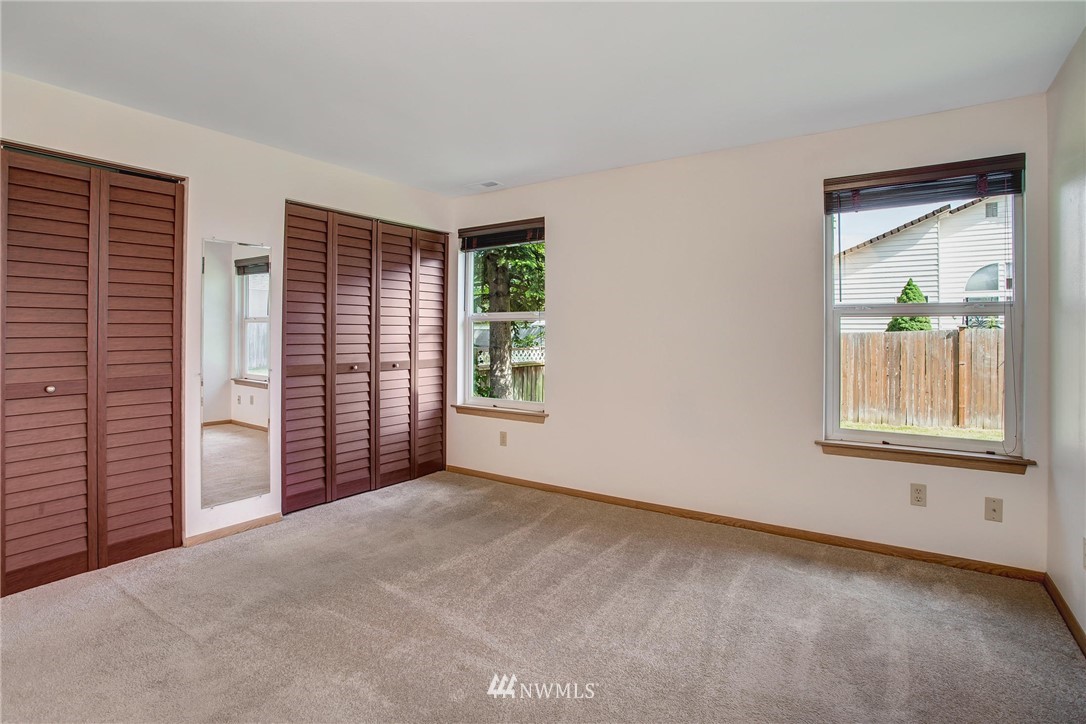 11206 Southeast 268th Street Kent, WA 98030 - Photo 17 of 23 an empty room with windows