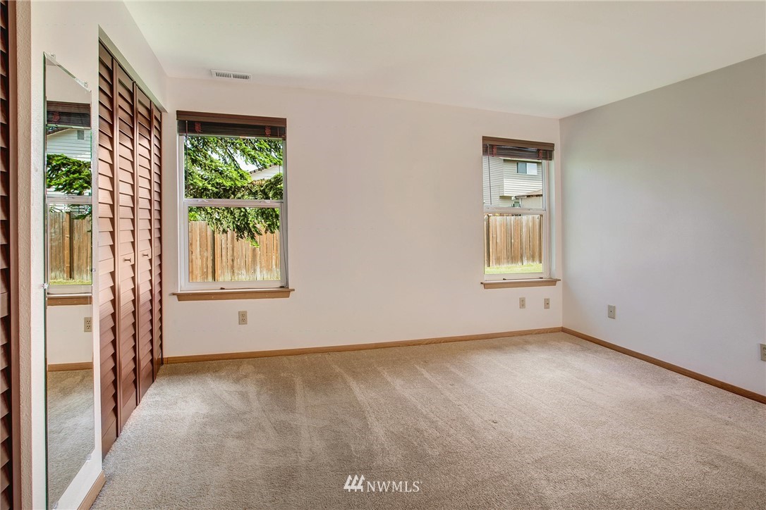 11206 Southeast 268th Street Kent, WA 98030 - Photo 18 of 23 an empty room with windows