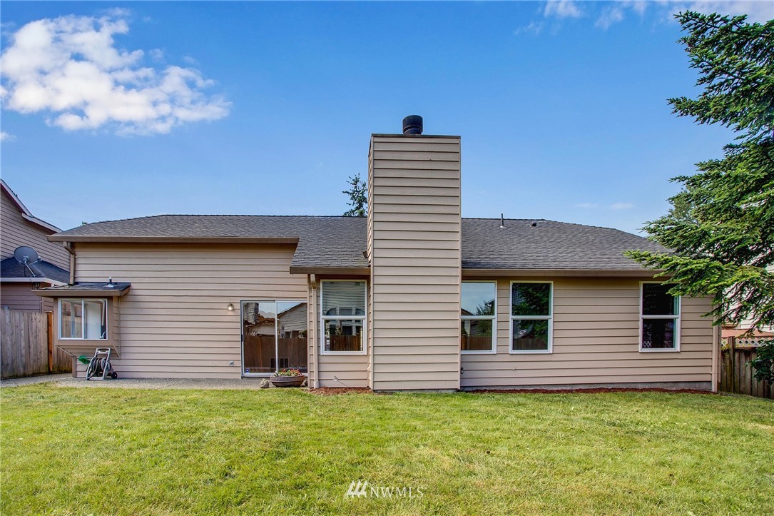 11206 Southeast 268th Street Kent, WA 98030 - Photo 3 of 23 a view of a house with a yard