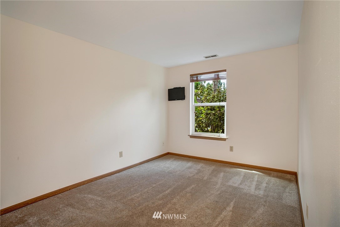 11206 Southeast 268th Street Kent, WA 98030 - Photo 21 of 23 an empty room with windows
