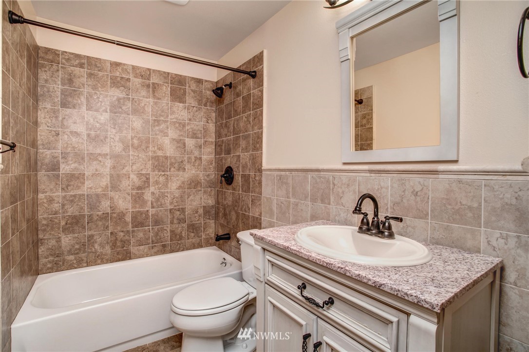 11206 Southeast 268th Street Kent, WA 98030 - Photo 23 of 23 a bathroom with a sink a toilet and a bathtub