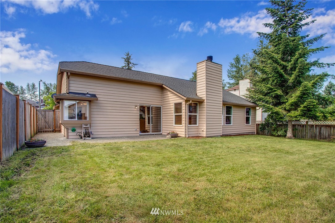 11206 Southeast 268th Street Kent, WA 98030 - Photo 4 of 23 a house view with a garden space