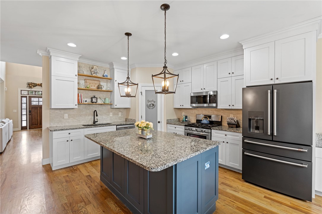 10 Colonel Storrs Court Greer, SC 29650 - Photo 12 of 48 Gourmet kitchen with an inviting island and elegant granite counters throughout.