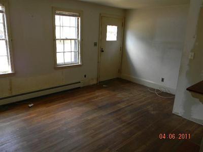 78 Lewis Road Hyannis, MA 02601 - Photo 11 of 13 an empty room with wooden floor and windows