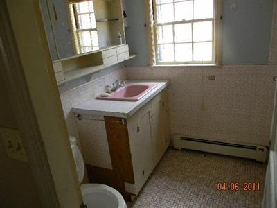 78 Lewis Road Hyannis, MA 02601 - Photo 4 of 13 a bathroom with a sink a toilet and a window