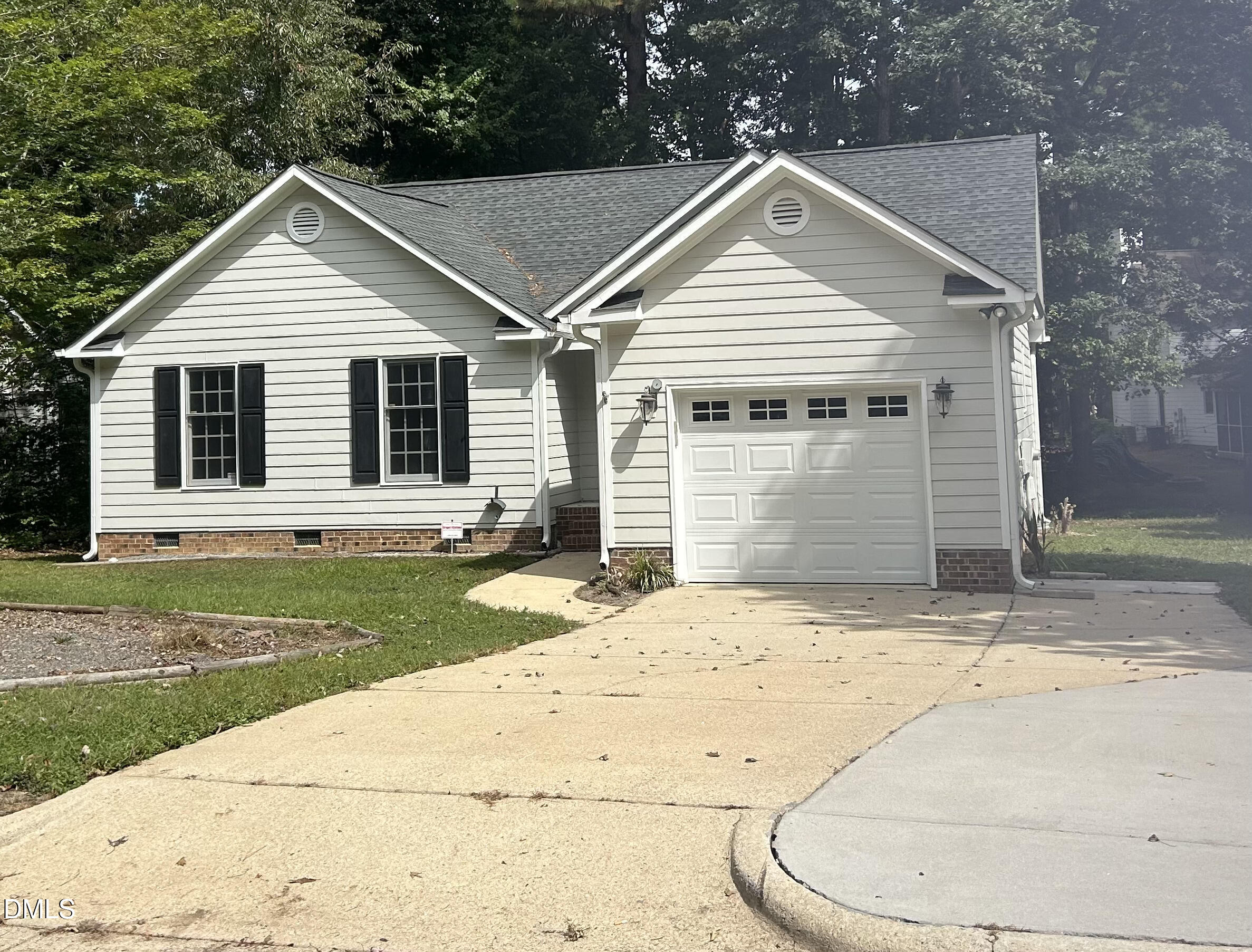 3529 Singleleaf Lane Raleigh, NC 27616 - Photo 1 of 16 a front view of a house with a yard