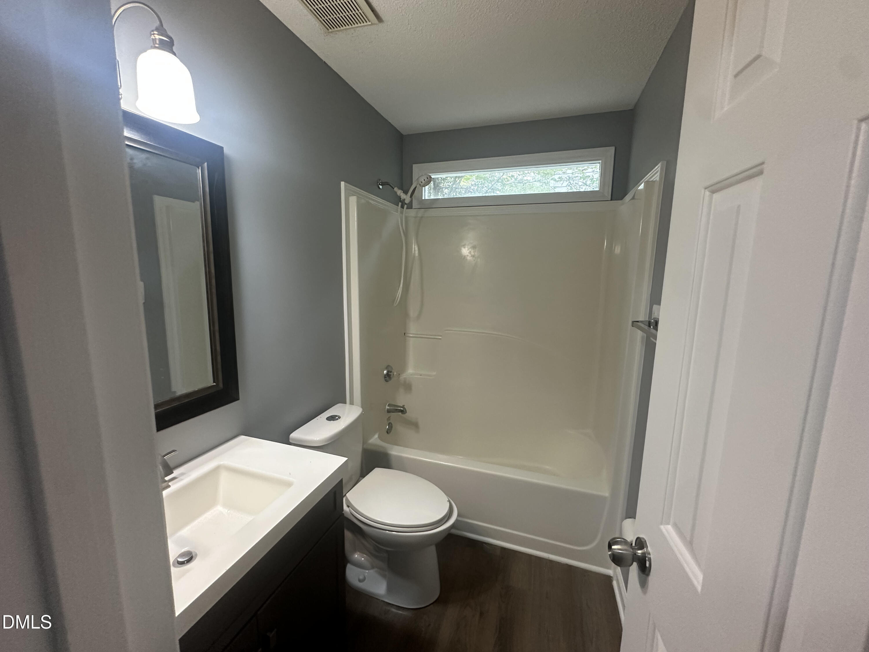 3529 Singleleaf Lane Raleigh, NC 27616 - Photo 10 of 16 a bathroom with a sink a toilet and shower