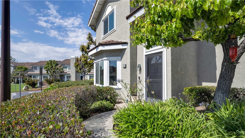 336 Fallingstar Irvine, CA 92614 - Photo 4 of 73 a view of a house with a tree and plants
