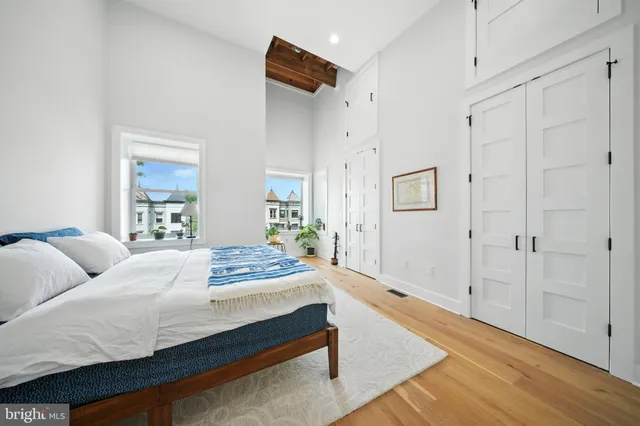 a bedroom with a bed and a table