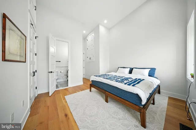 a bedroom with a bed and a table