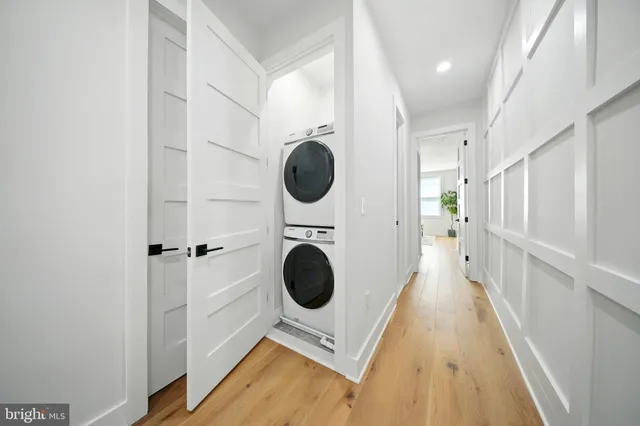 a view of a hallway with washer and dryer