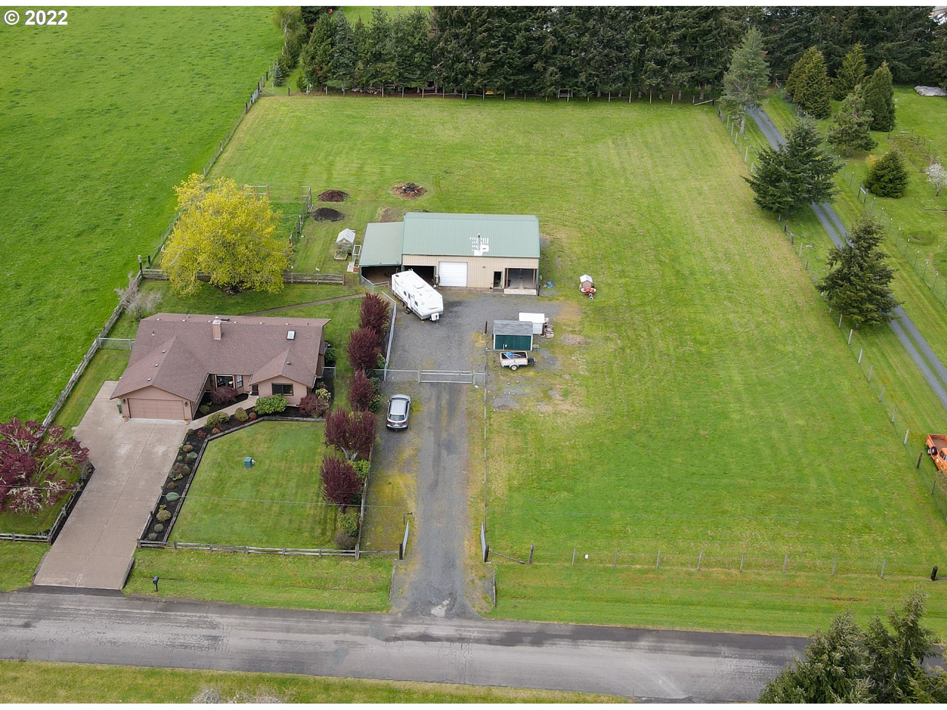 78566 Cedar Park Road Cottage Grove, OR 97424 - Photo 1 of 32 an aerial view of a house with a yard