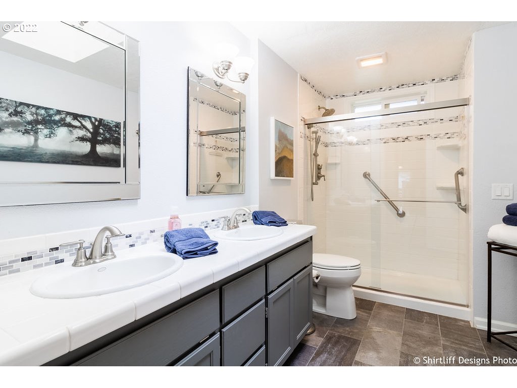 78566 Cedar Park Road Cottage Grove, OR 97424 - Photo 16 of 32 a bathroom with a sink toilet and shower