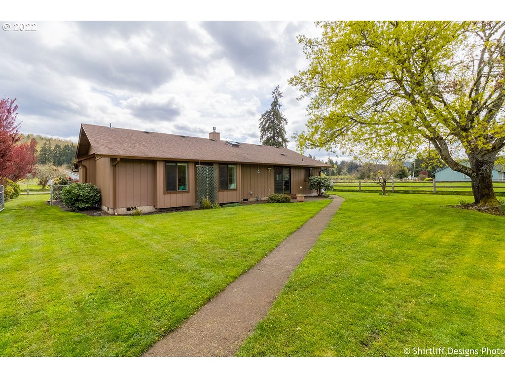 78566 Cedar Park Road Cottage Grove, OR 97424 - Photo 26 of 32 a view of an house with backyard space and balcony