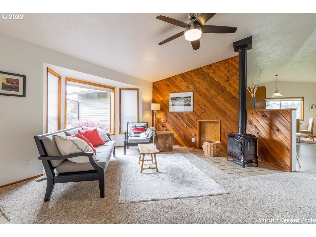 78566 Cedar Park Road Cottage Grove, OR 97424 - Photo 5 of 32 a living room with furniture and a fireplace