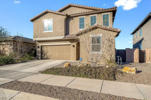 a front view of a house with yard