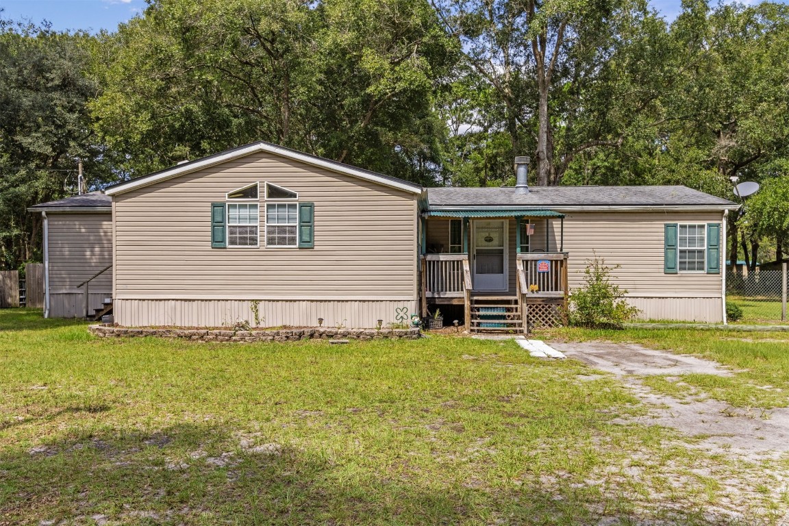85135 Miner Road Yulee, FL 32097 - Photo 1 of 32 a view of a house with a yard