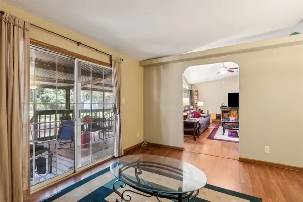 a living room with furniture and a window