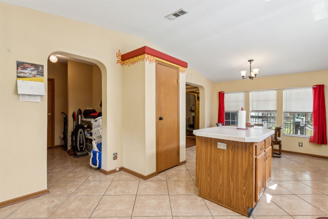 85135 Miner Road Yulee, FL 32097 - Photo 18 of 32 a view of a kitchen with a sink and a refrigerator