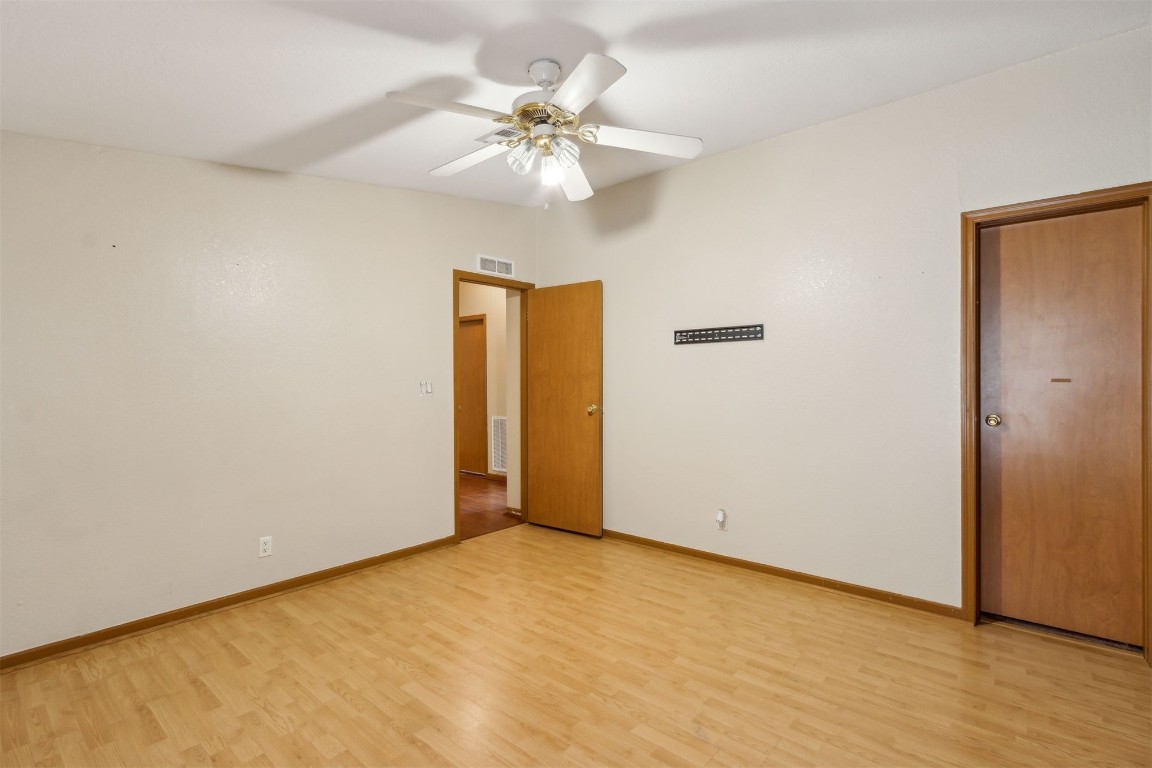 85135 Miner Road Yulee, FL 32097 - Photo 29 of 32 a view of an empty room with wooden floor