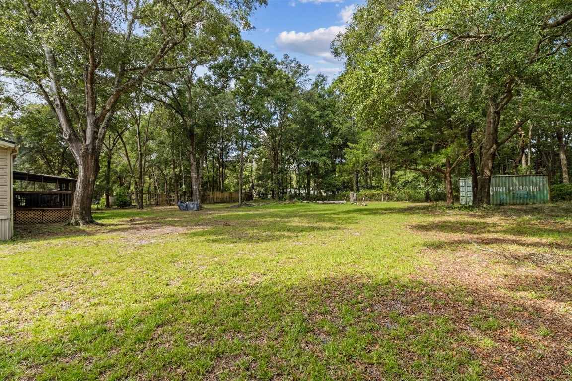 85135 Miner Road Yulee, FL 32097 - Photo 3 of 32 a view of a swimming pool and trees in the background