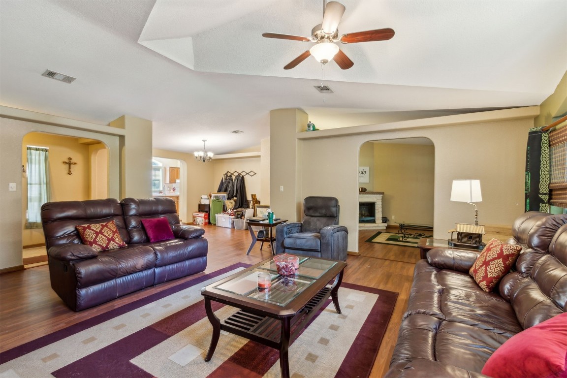 85135 Miner Road Yulee, FL 32097 - Photo 7 of 32 a living room with furniture a rug and a chandelier
