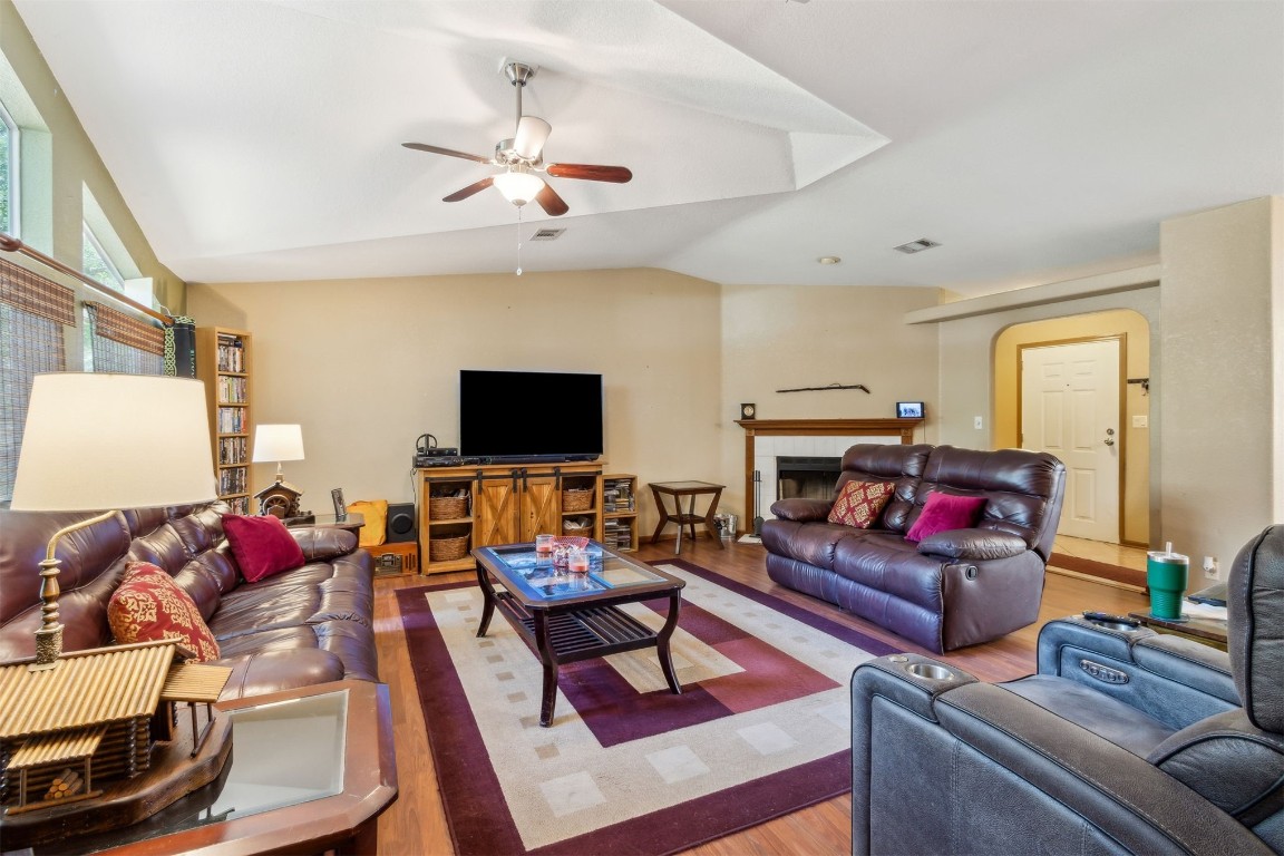 85135 Miner Road Yulee, FL 32097 - Photo 8 of 32 a living room with furniture a flat screen tv and a fireplace