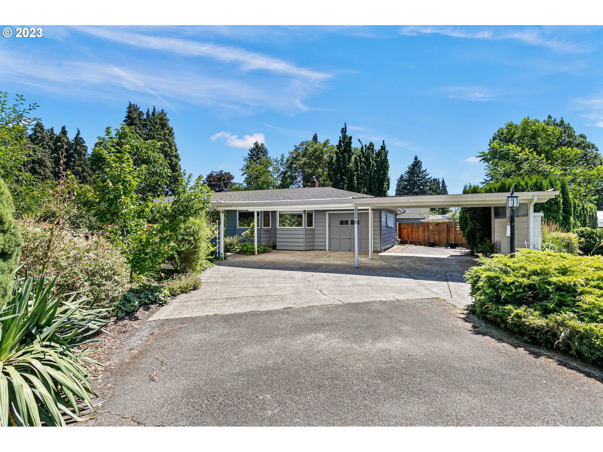 2899 Wayside Loop Springfield, OR 97477 - Photo 3 of 31 a front view of a house with a garden