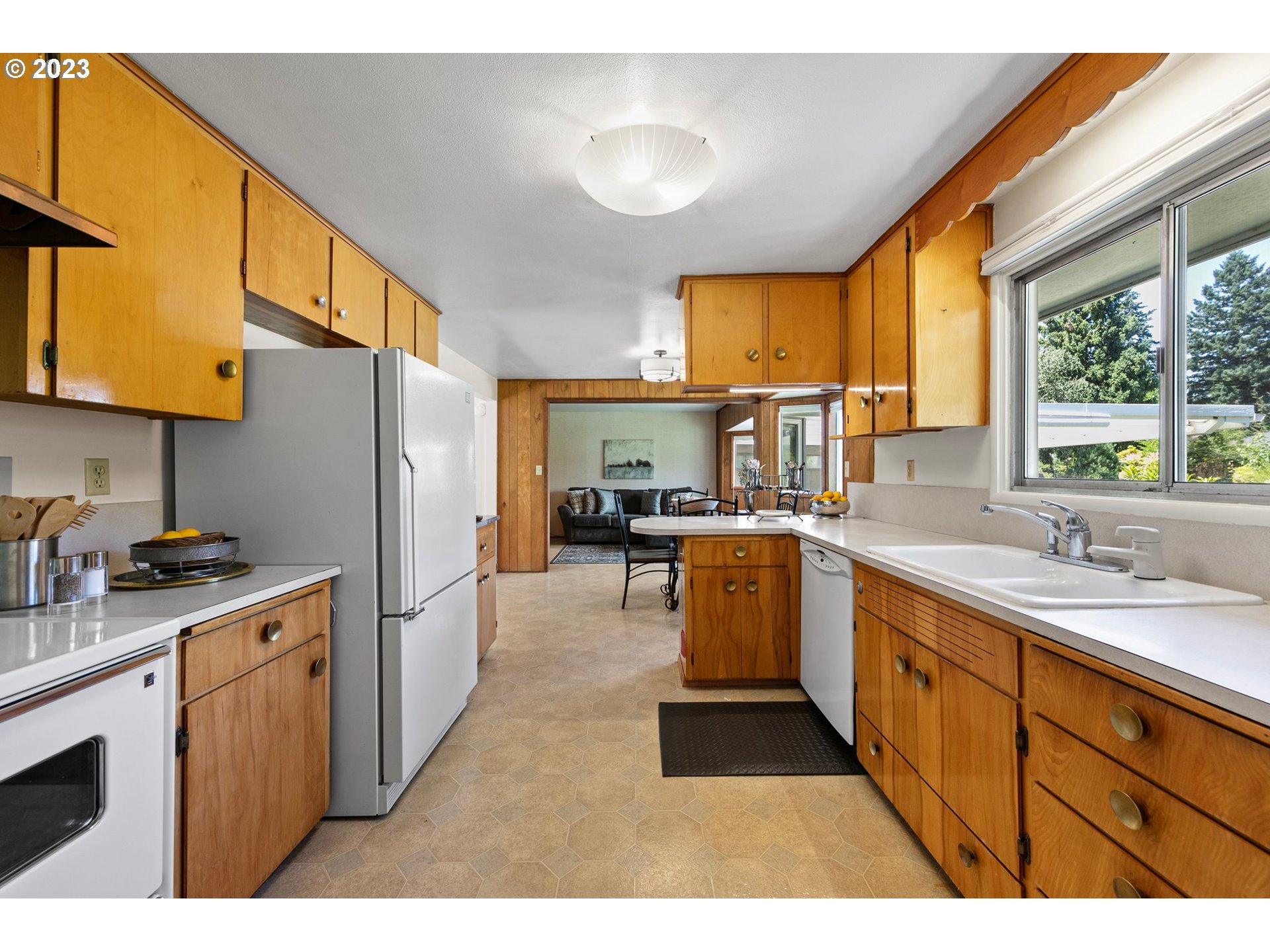 2899 Wayside Loop Springfield, OR 97477 - Photo 7 of 31 a kitchen with a sink stove and refrigerator