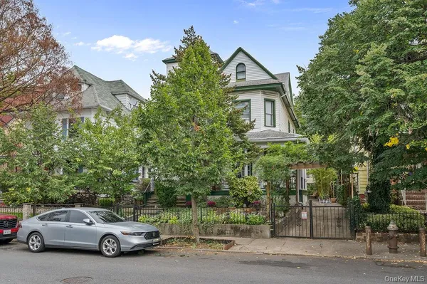 a car parked in front of a house