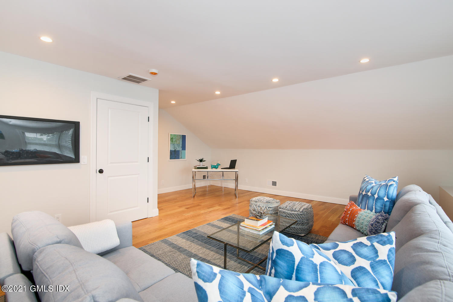 8 Sound Beach Ave Extension, Unit 3 Riverside, CT 06878 - Photo 22 of 29 a living room with furniture and a flat screen tv