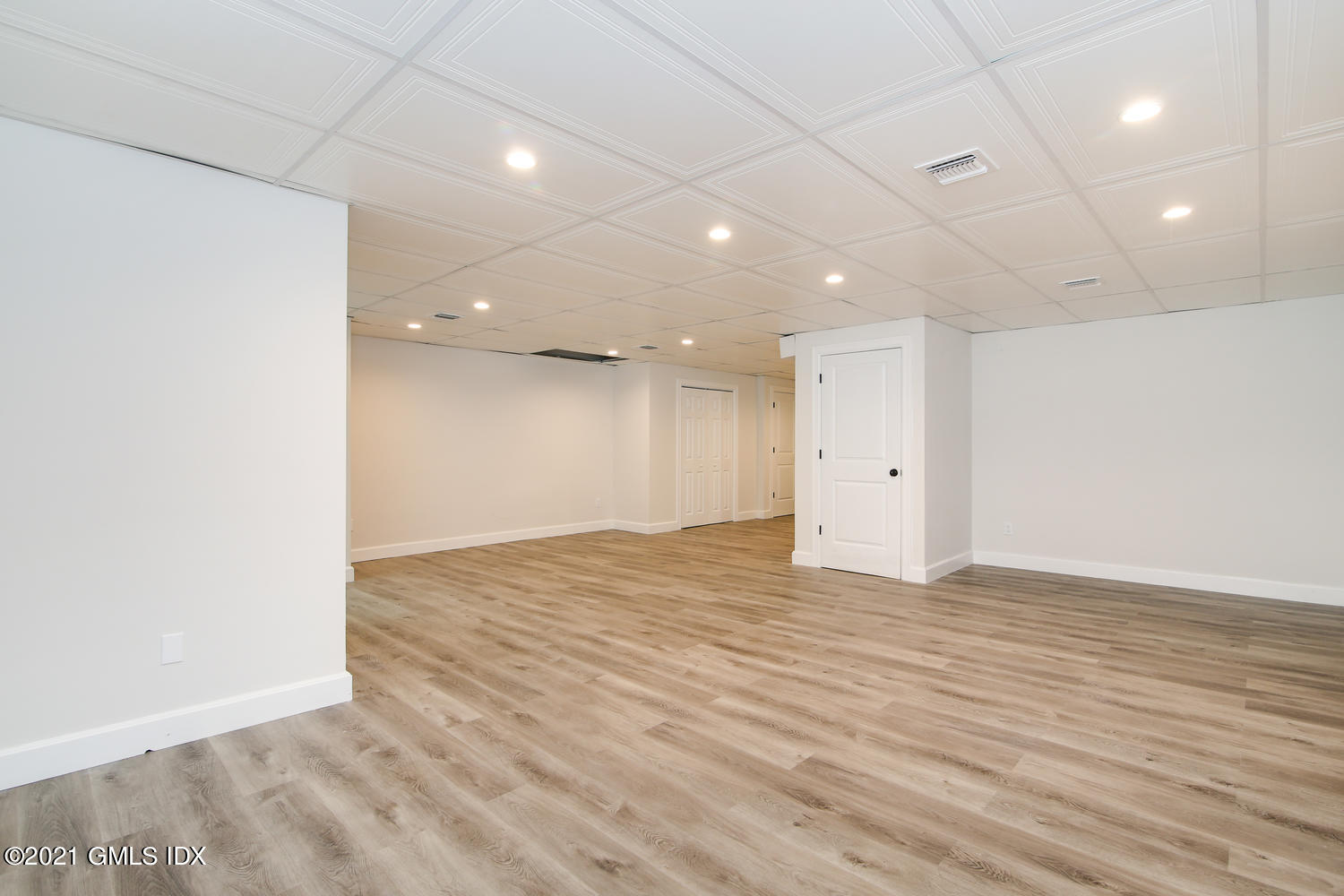 8 Sound Beach Ave Extension, Unit 3 Riverside, CT 06878 - Photo 23 of 29 a view of an empty room with wooden floor