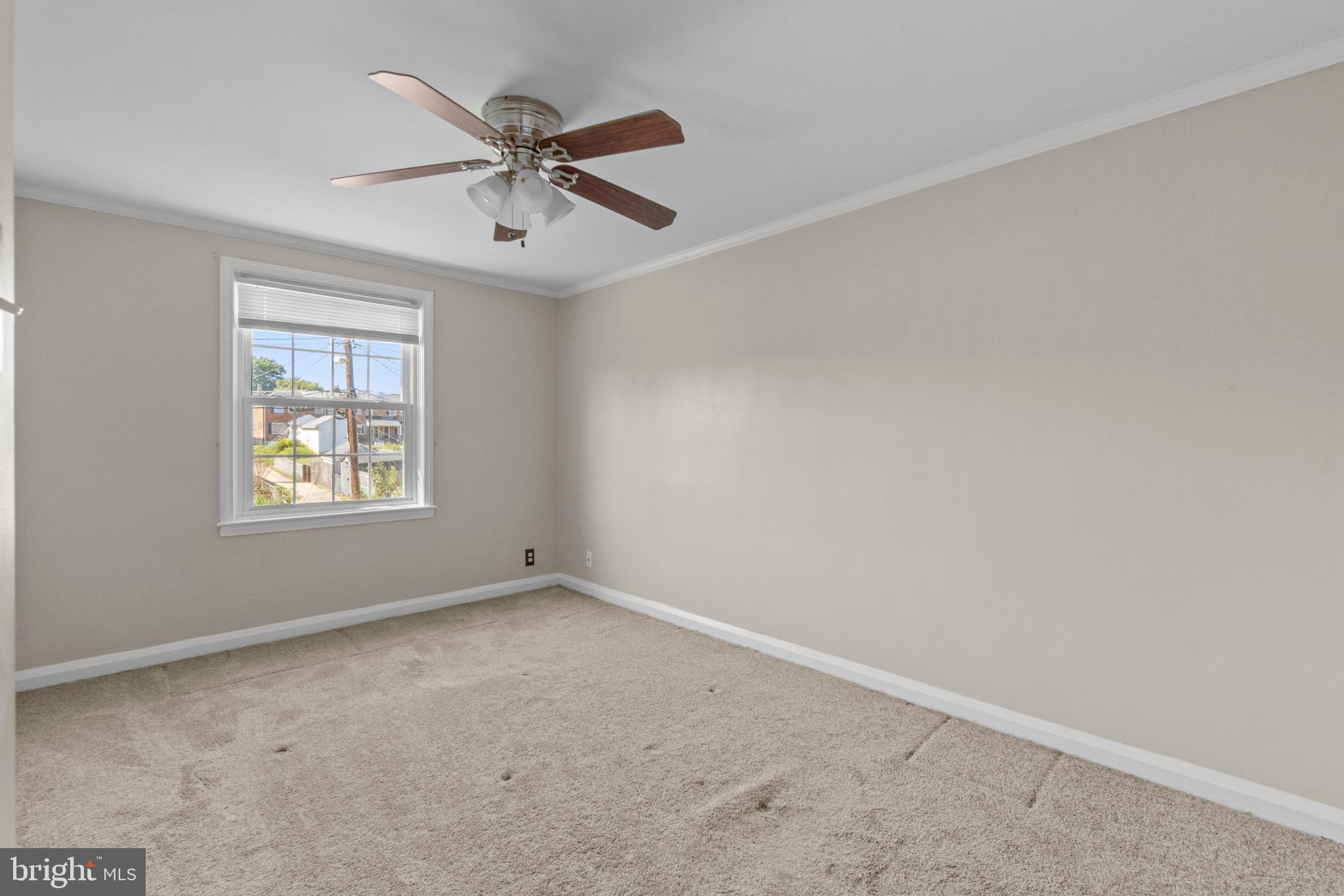 5514 Council Street Halethorpe, MD 21227 - Photo 17 of 36 an empty room with a window and a fan