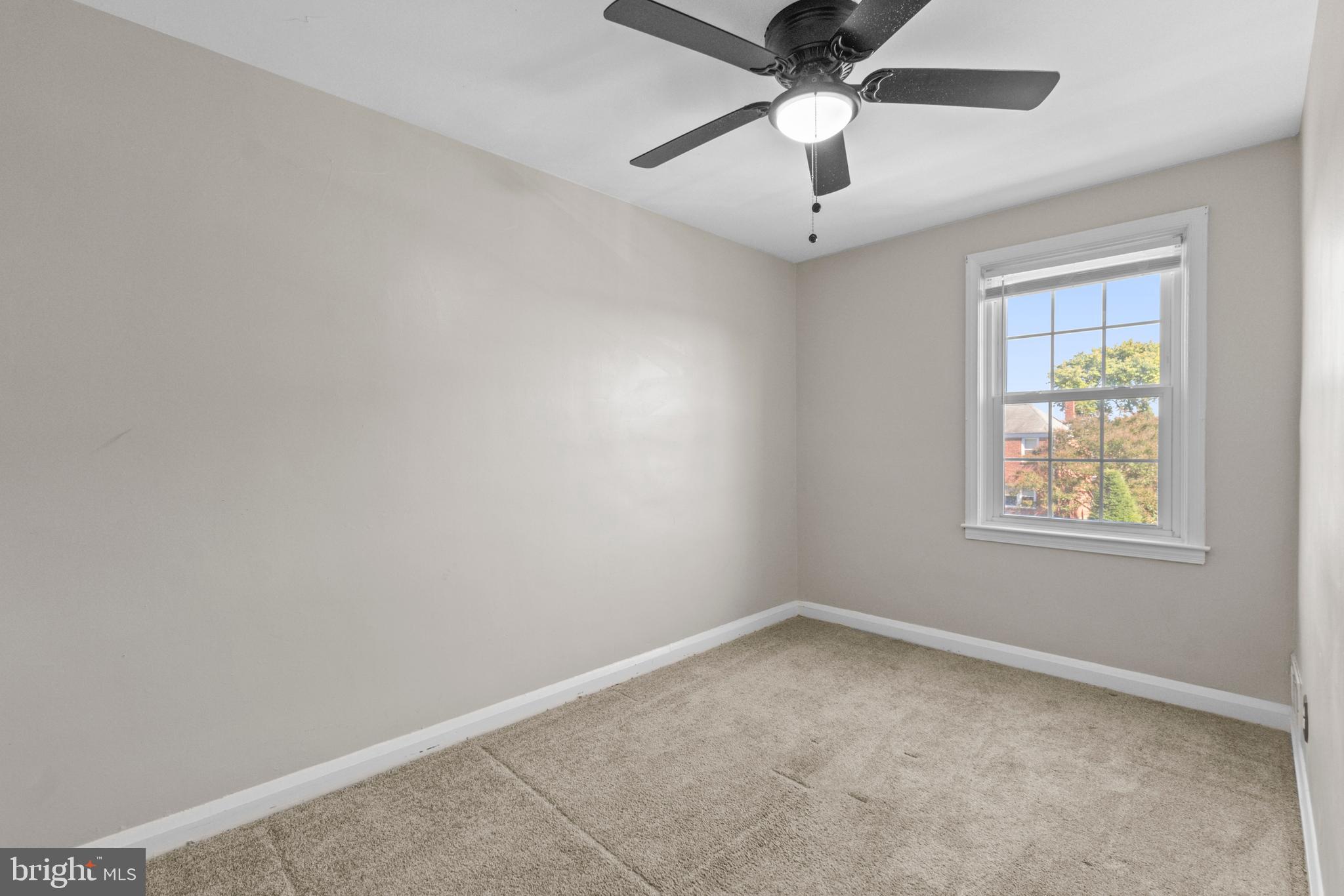 5514 Council Street Halethorpe, MD 21227 - Photo 25 of 36 an empty room with a window and a fan